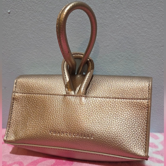 Chantecaille Handbags - Chantecaille Metallic Gold Loop Lock Wristlet